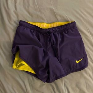 Nike dry fit shorts. Size small. Purple and yellow/green